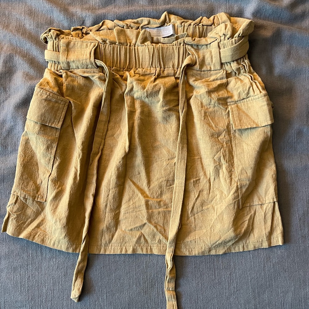 Tan skirt with buttons on the side